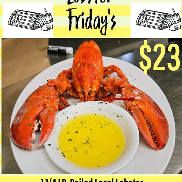 A boiled lobster with drawn butter on a white plate, advertising "Lobster Friday's" for $23.