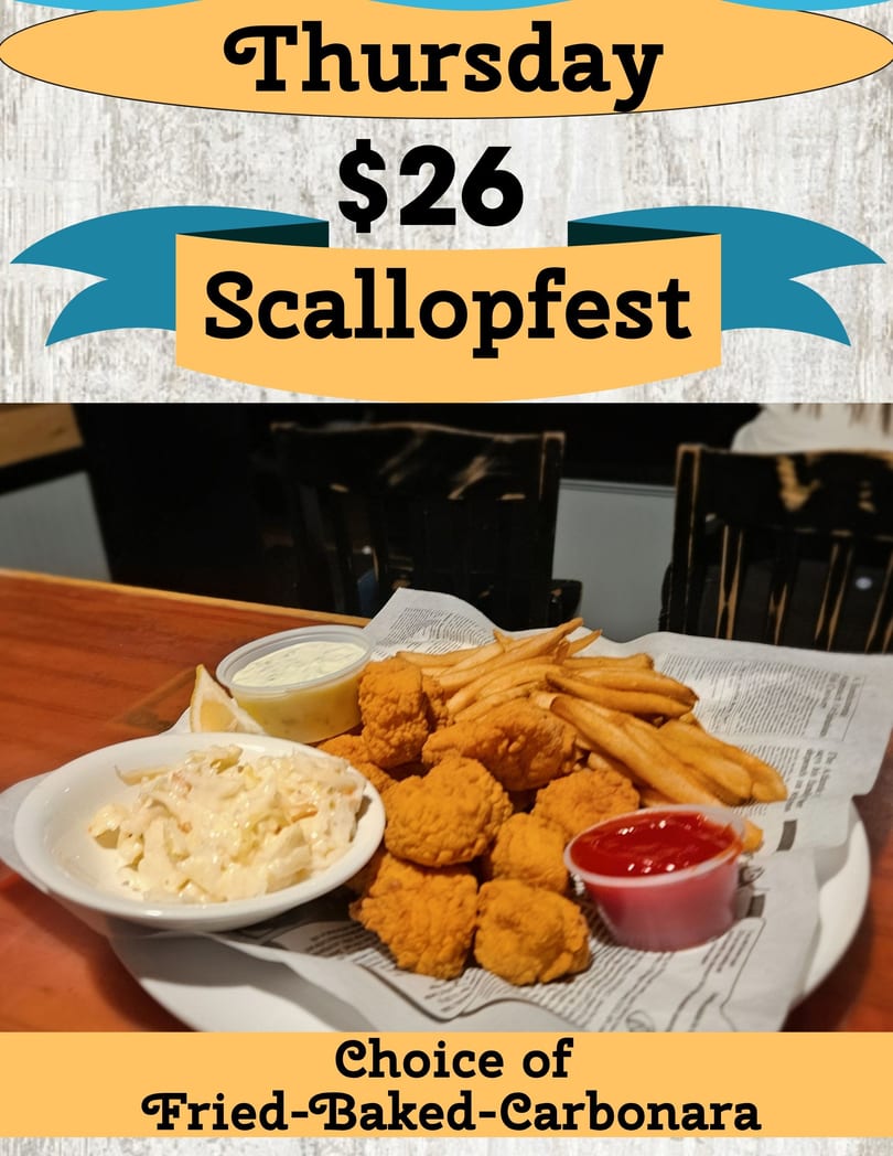 Fried scallops, french fries, coleslaw, tartar sauce, and ketchup on a plate.